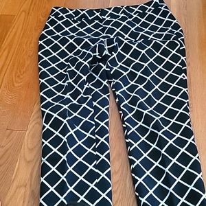Ladies black and white checker board ankle length pants.